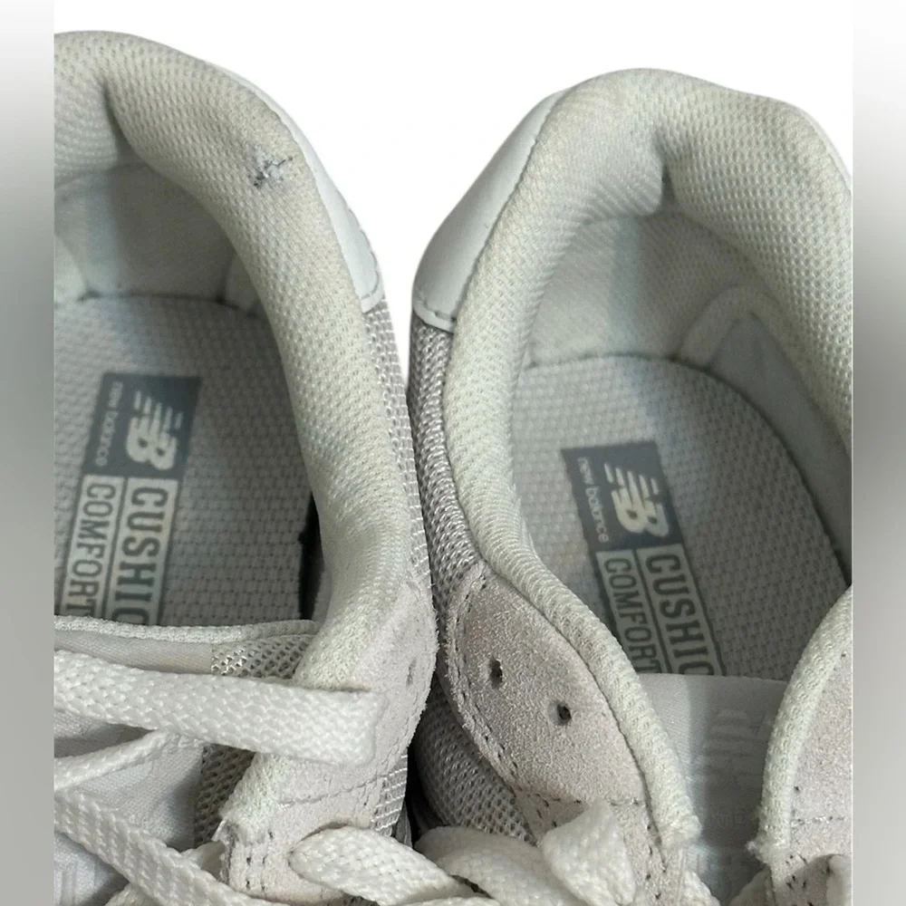 New Balance Grey / White athletic sneakers.